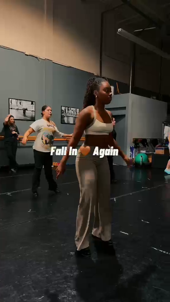 Dancers practising choreography together in the studio